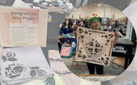 Project creator Jesse Sprocket Displays one of her print block bandanas aimed at bringing awareness to displaced populations of the world.